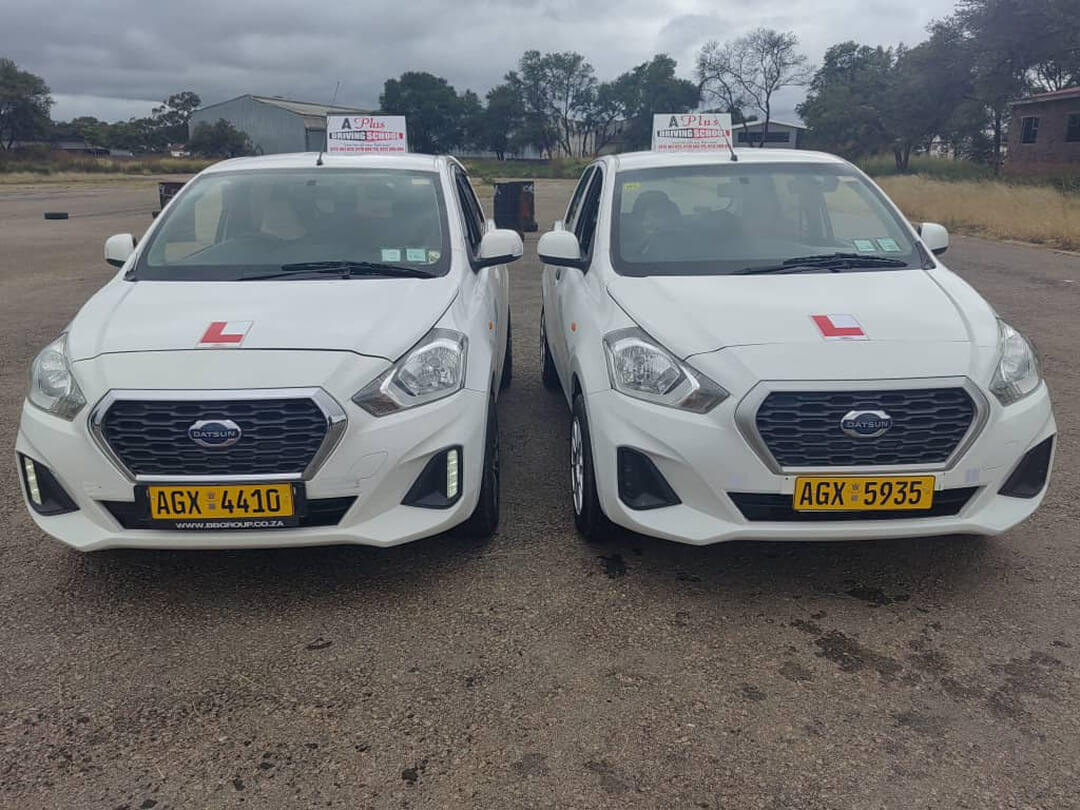 White learner-driver training cars